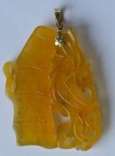 A Chinese yellow jade pendant with loop top. Est.