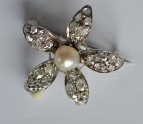 An attractive diamond and pearl flower decorated b