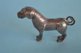 A Continental figure of a dog with engraved body.