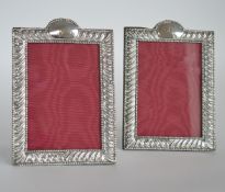 A pair of good quality embossed picture frames wit