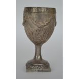 A heavy Irish goblet with swag decoration. Approx.