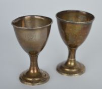 A pair of Georgian Irish egg cups on reeded suppor