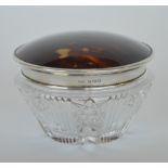 A good quality circular dressing table bottle with