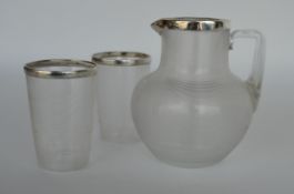 An attractive silver mounted reeded jug together w