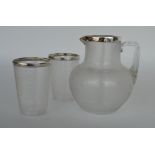 An attractive silver mounted reeded jug together w