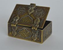 An unusual brass Islamic box with hinged top. Est.