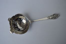 A good quality heavy tea strainer with pierced ter