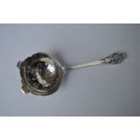 A good quality heavy tea strainer with pierced ter