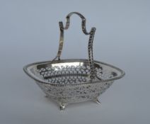 A pierced bonbon dish on four supports with gadroo