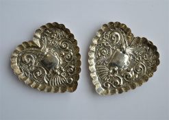 A pair of attractive heart shaped pin dishes with