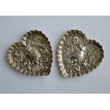 A pair of attractive heart shaped pin dishes with