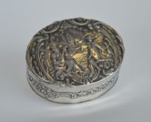A silver oval embossed trinket box. London.