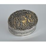 A silver oval embossed trinket box. London.