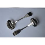 A pair of heavy fiddle pattern sauce ladles. Londo