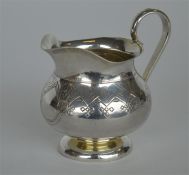 A good quality Russian engraved cream jug marked t