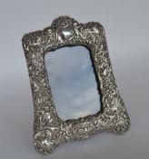 A tall, embossed, silver mounted, picture frame de