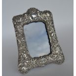 A tall, embossed, silver mounted, picture frame de