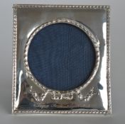 A rectangular picture frame with bow decoration an