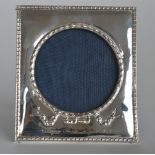 A rectangular picture frame with bow decoration an