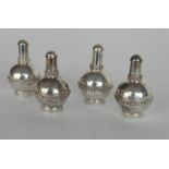 A heavy set of four Eastern pepper pots with ball