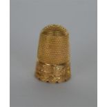 A small 15 carat thimble with engraved decoration.