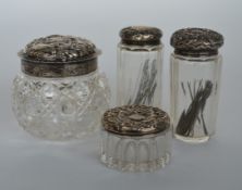 A group of four silver mounted embossed top dressi