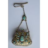 A good quality silver gilt purse with engraved dec