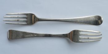 A heavy set of four Georgian OE pattern table forks. London 1799. By WS. Est. £100 - £150.