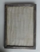 A rectangular plain edged picture frame with velvet back. Birmingham. Approx. 22 cms high. Est. £