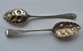 A pair of early Georgian bright cut berry spoons,