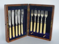 A cased set of five, plus five, bone handled and silver bladed fish knives and forks. Sheffield.