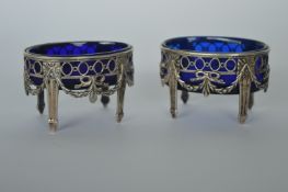 A pair of attractive Continental salts with swag decoration and pierced sides. Est. £80 - £100.