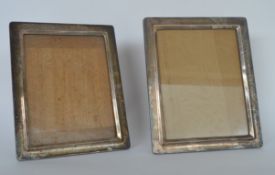 A rectangular pair of silver picture frames with oak panelled backs. Approx. 28 cms high. Est £200 -