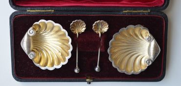 A boxed pair of shell shaped salts and matching sp