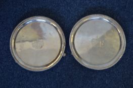 A good pair of Georgian salvers with gadroon rim a