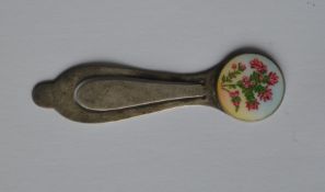 A silver enamel decorated bookmark in the form of