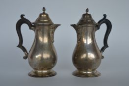 A pair of good quality lidded jugs with baluster shaped bodies. Approx. 460 grams. Chester. By HF.