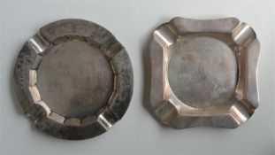 A heavy silver ashtray together with one other. London. By RC. Approx. 299 grams. Est. £30 - £50.