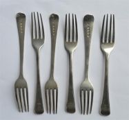 A set of five, plus one, Georgian OE pattern dessert forks. London 1807. By JW. Approx. 195 grams.