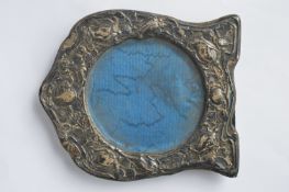 A stylish picture frame with wavy edge and leaf and flower decoration. Birmingham. Approx. 15 cms