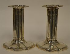 A good pair of piano candlesticks with wavy edge.