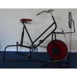 An unusual exercise bike with chrome handlebars. B