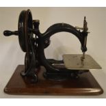 A Willcox and Gibbs sewing machine with a Japanned