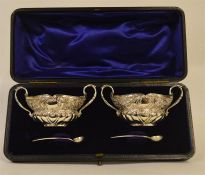 A good boxed pair of salts decorated with scrolls