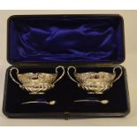 A good boxed pair of salts decorated with scrolls