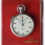 OMEGA: A gent's stopwatch with original box and pa