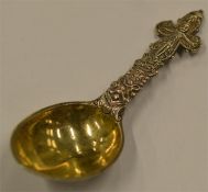 An unusual Continental caddy spoon with gilt bowl,