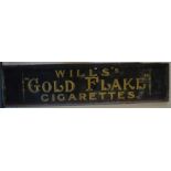 A "Will's Gold Flake Cigarettes" advertising plaqu