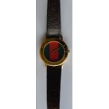 GUCCI: A lady's gilt wristwatch on leather strap.