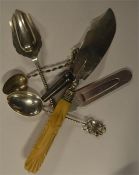 A quantity of silver spoons, butter knife, whistle